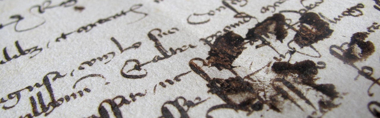 cat paw prints on old manuscript