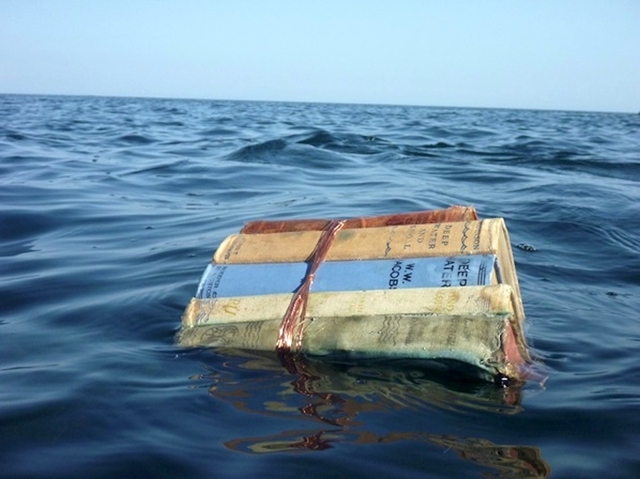 Books Floating On Ocean